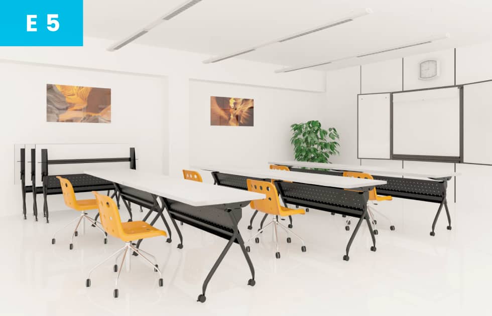 yellow chairs and large workspace for classroom