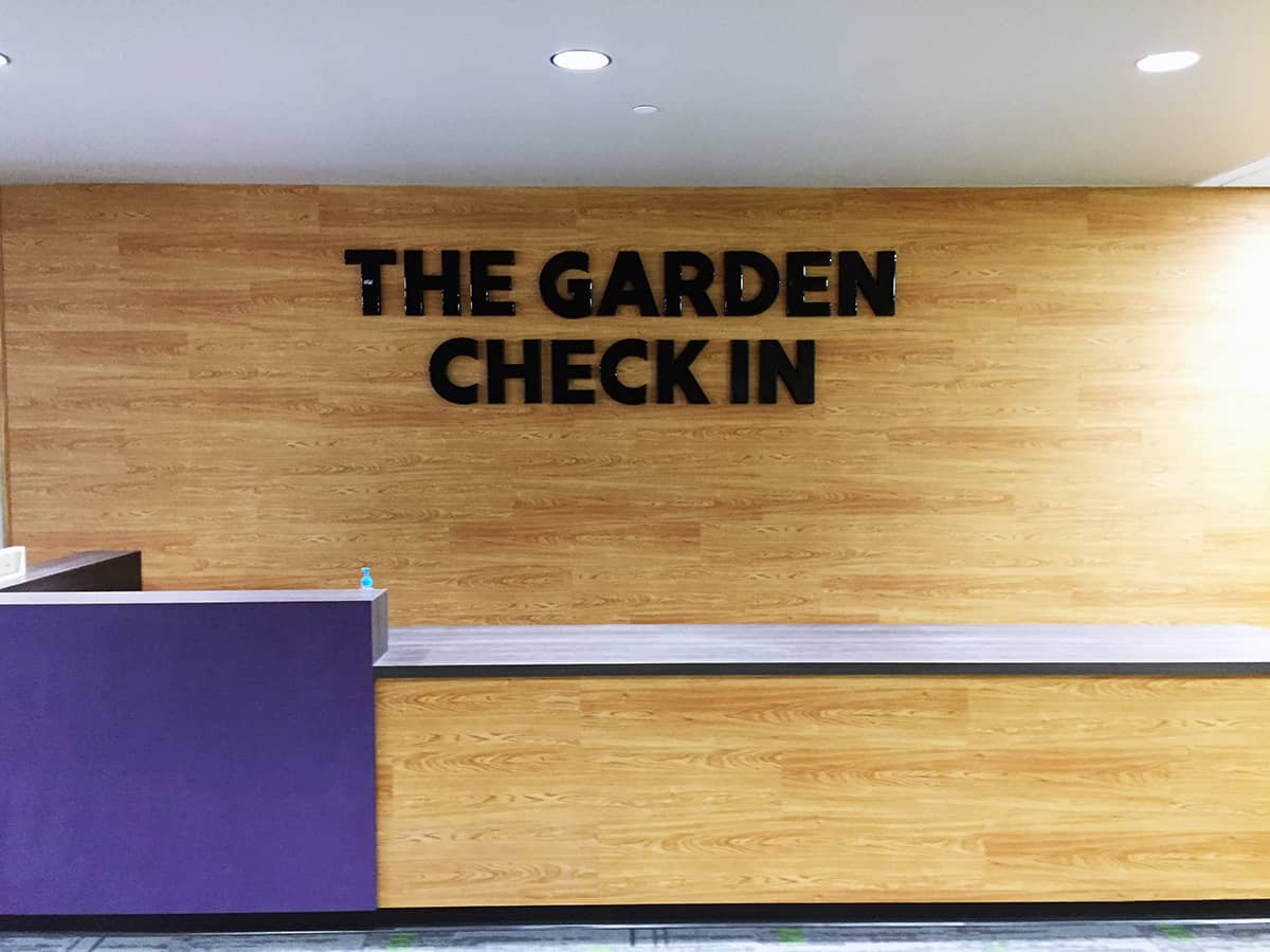 The Garden Check In Signage